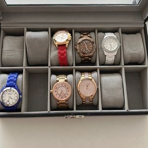 Coach (blu and red), Michael Kors (rose golds), and Fossil (white) watches